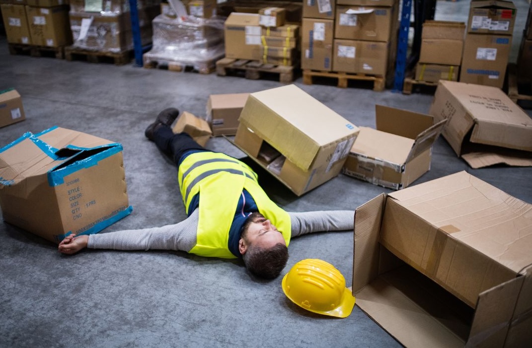 a man lying on the floor with his arms stretched out